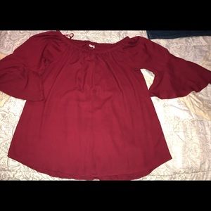 Very stylish dark red off the shoulder blouse.